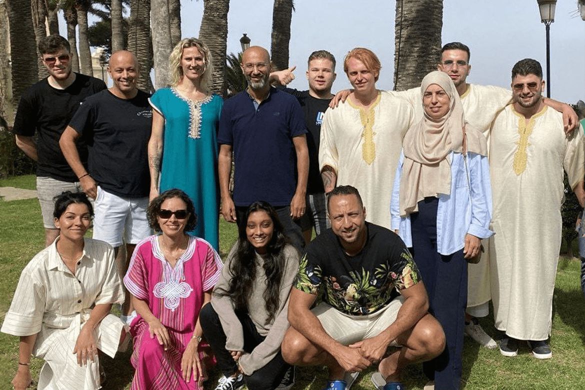 Participants under the palms